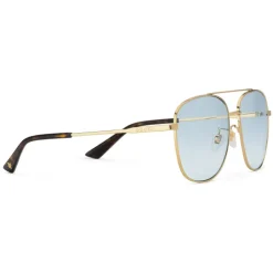 Gucci - Navigator Sunglasses in Metal - Shiny Gold Lenses Blue - Gucci Eyewear - Avvenice